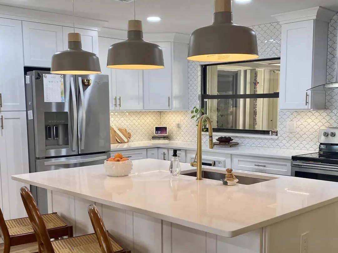 Finished kitchen with island, pendant lights and new flooring